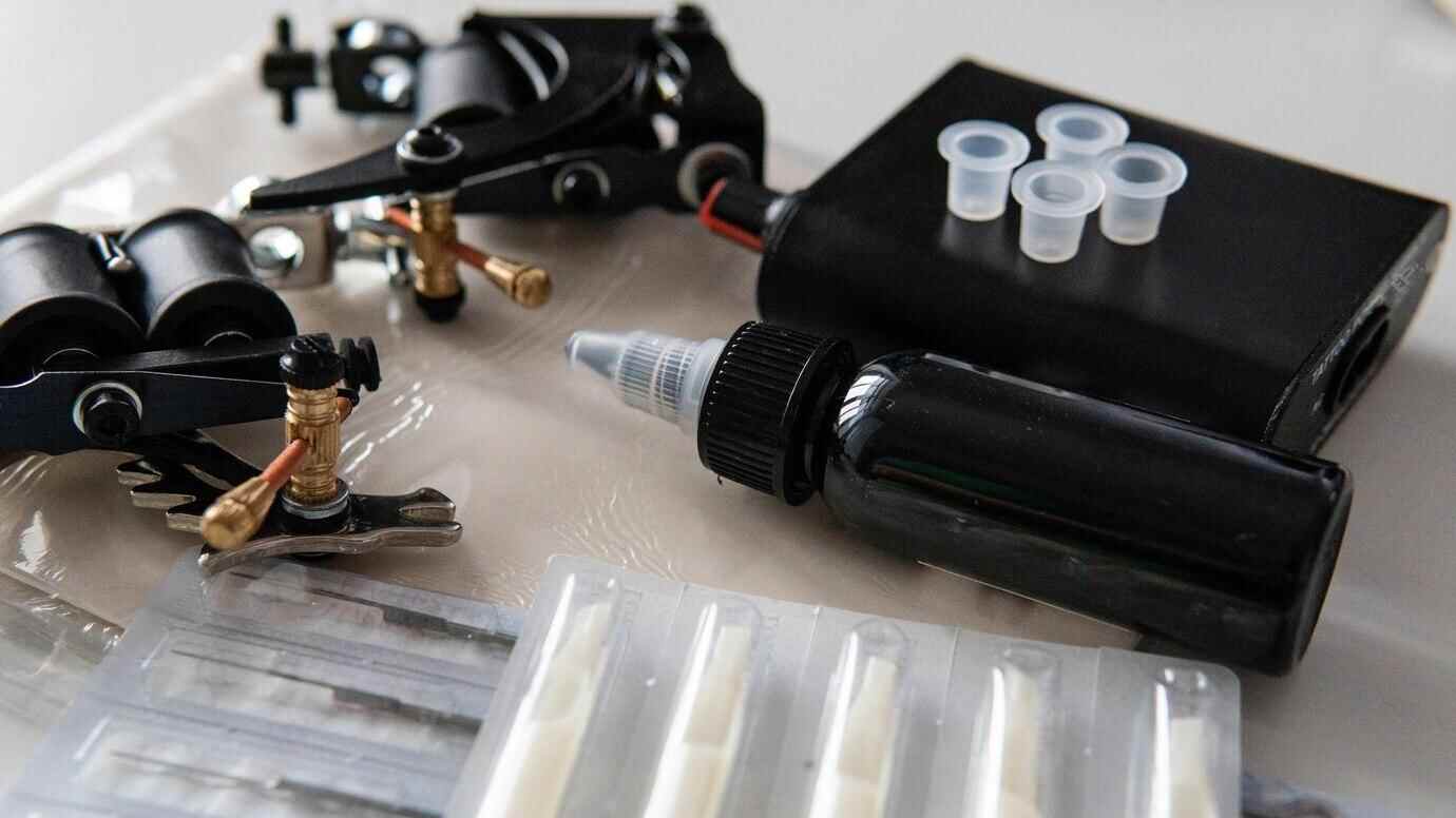 Quality tattoo and piercing supplies displayed and laid out.