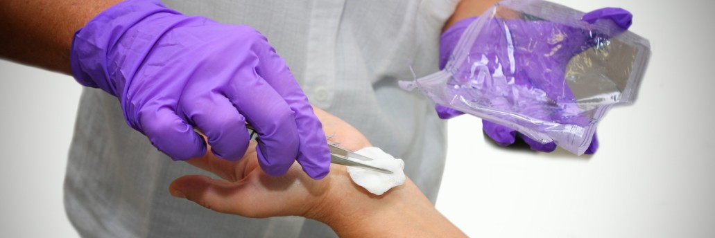 Image of a doctor performing Wound Cleaning
