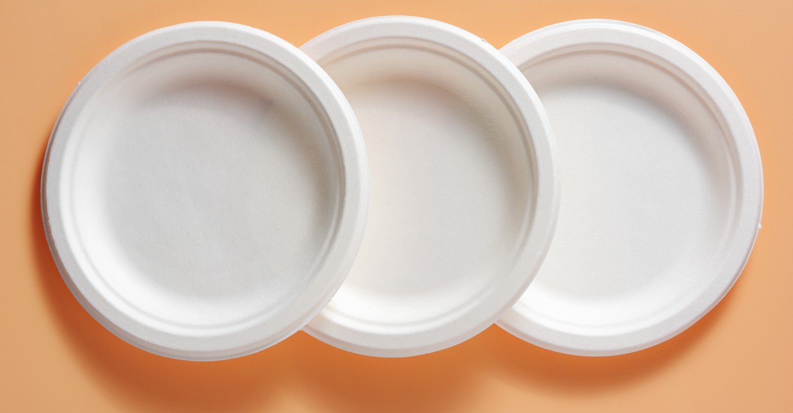 Disposable white plastic plates on display