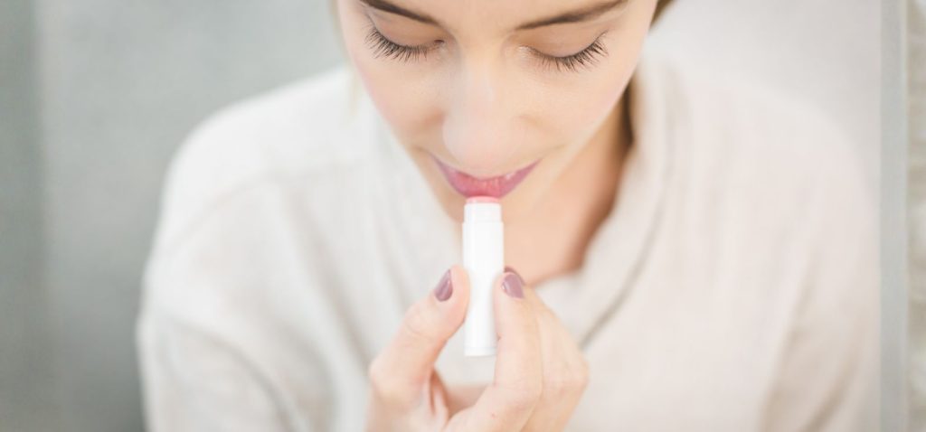 Woman_Using_Lipstick Right Lip Balm for You